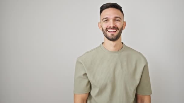 Young Hispanic Man Smiling Pointing Side Isolated White Background — Stock Video