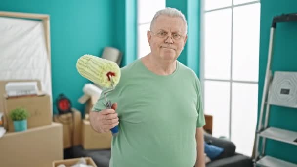 Middle Age Grey Haired Man Smiling Confident Holding Paint Roller — Stock Video