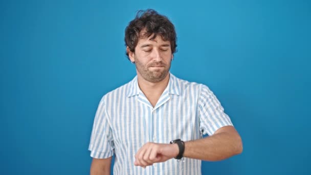 Young Hispanic Man Pointing Watch Saying Head Isolated Blue Background — Stock Video