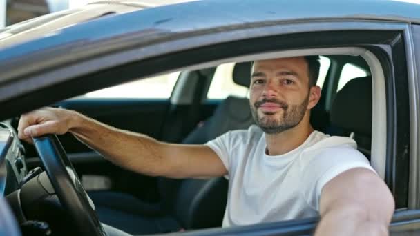 Young Hispanic Man Smiling Confident Holding Key New Car Street — стоковое видео