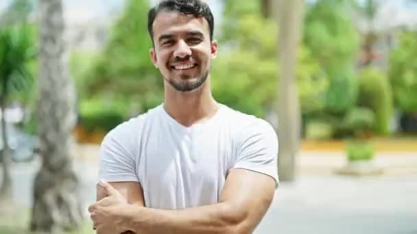 Young Hispanic Man Smiling Confident Standing Arms Crossed Gesture Park — Stockvideo