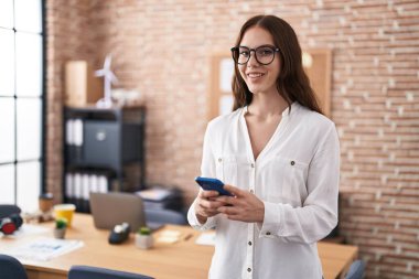 Young woman business worker using smartphone working at office