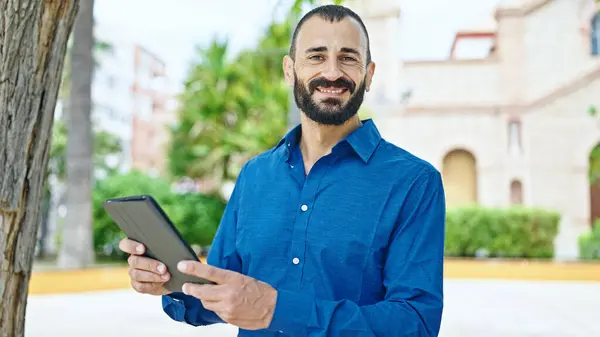 Young Hispanic Man Smiling Confident Using Touchpad Park —  Fotos de Stock