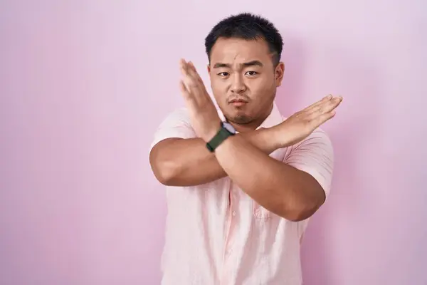 Chinese Young Man Standing Pink Background Rejection Expression Crossing Arms — Stock Photo, Image