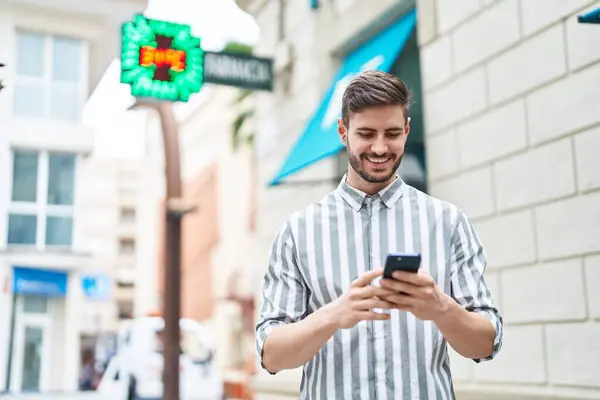 Young Caucasian Man Smiling Confident Using Smartphone Pharmacy — Stock fotografie