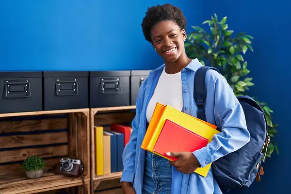 African American Woman Wearing Student Backpack Holding Books Looking Positive — Stock Photo, Image