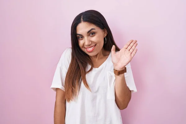 Young Arab Woman Standing Pink Background Waiving Saying Hello Happy — Stock Photo, Image