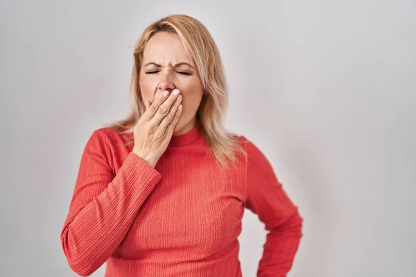 Blonde Woman Standing Isolated Background Bored Yawning Tired Covering Mouth — Stock Photo, Image