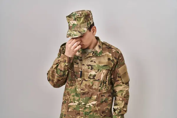 Young Arab Man Wearing Camouflage Army Uniform Tired Rubbing Nose — Stock Photo, Image