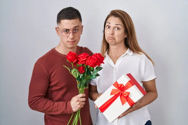 Mother Son Holding Mothers Day Gift Skeptic Nervous Frowning Upset — Foto Stock