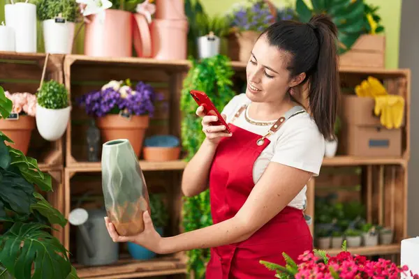 Young Beautiful Hispanic Woman Florist Make Photo Smartphone Plant Jar —  Fotos de Stock