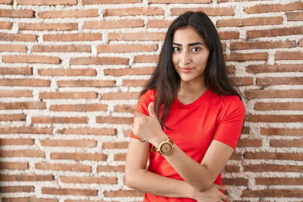 Young Teenager Girl Standing Bricks Wall Pointing Hand Finger Side — Stock Photo, Image