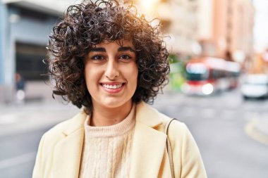 Young middle east woman excutive smiling confident standing at street