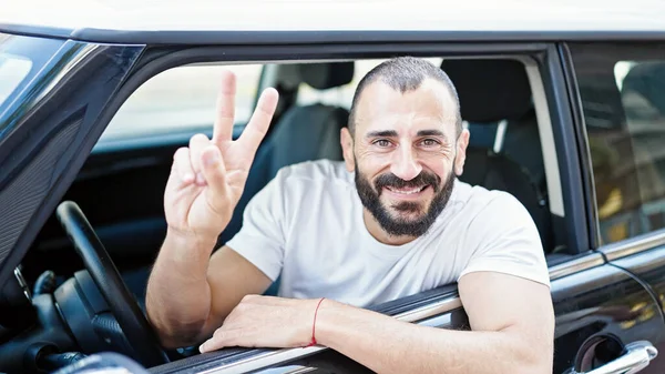 Young Hispanic Man Leaning Door Car Doing Victory Gesture Street — Stock Photo, Image