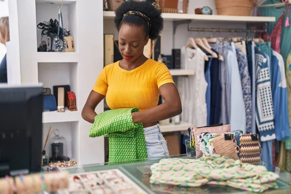 African American Woman Shop Assistant Folding Clothes Working Clothing Store — Fotografia de Stock