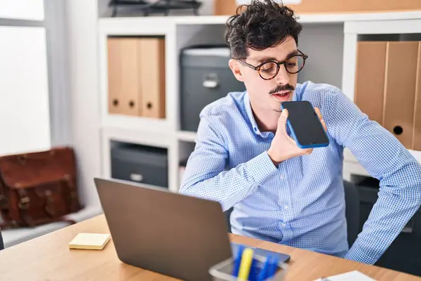 Young Caucasian Man Business Worker Using Laptop Talking Smartphone Office — Zdjęcie stockowe