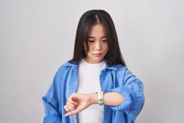 Young Chinese Woman Standing White Background Checking Time Wrist Watch — Stock Photo, Image