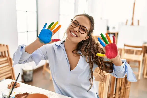 Young Beautiful Hispanic Woman Artist Smiling Confident Showing Painted Hands — Stock Photo, Image