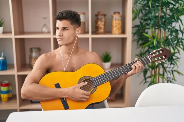 Young Hispanic Man Playing Classical Guitar Home — Stockfoto