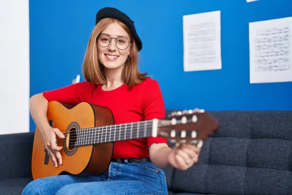Young Redhead Woman Musician Smiling Confident Playing Classical Guitar Music — Stockfoto