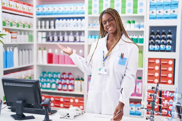 African American Woman Pharmacist Smiling Confident Writing Document Pharmacy —  Fotos de Stock