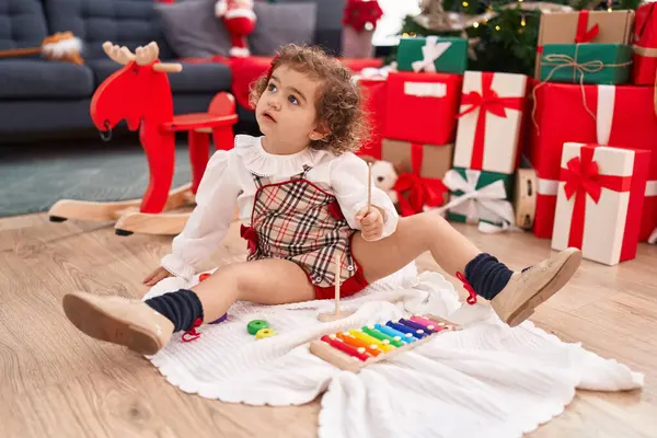 Adorable Hispanic Girl Playing Xylophone Sitting Floor Christmas Tree Home — Foto de Stock