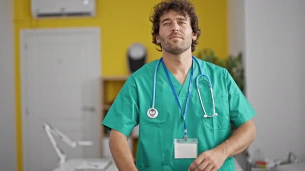 Young Hispanic Man Doctor Standing Serious Expression Arms Crossed Gesture — Stock Video