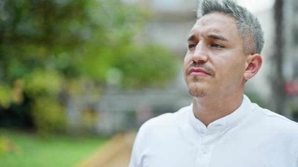Young Hispanic Man Breathing Closed Eyes Park — Stockvideo