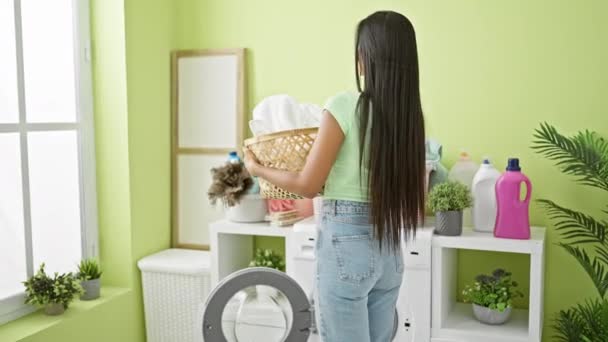 Young Latin Woman Smiling Confident Holding Basket Clothes Laundry Room — Stok video