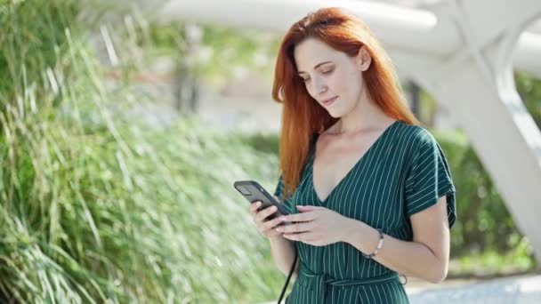 Young Redhead Woman Smiling Confident Talking Smartphone Park — Vídeos de Stock