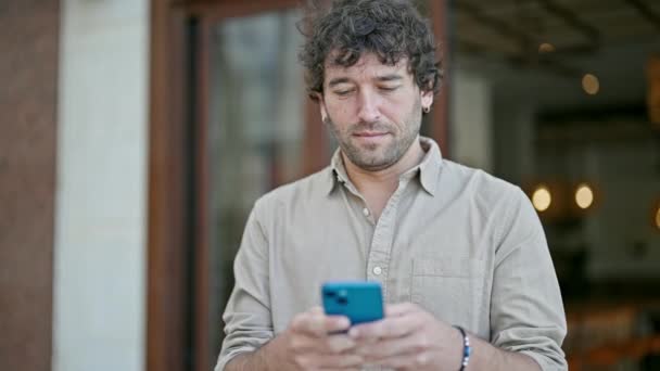 Young Hispanic Man Smiling Confident Using Smartphone Street — Stock Video