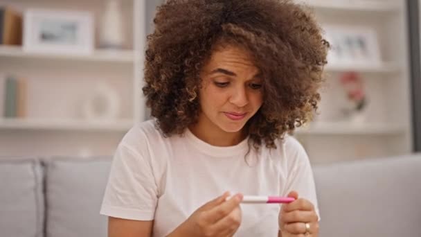 Young Beautiful Hispanic Woman Looking Pregnancy Test Winner Gesture Home — Stock Video