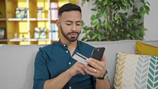 Young Hispanic Man Doing Online Shopping Sitting Sofa Home — Stock Video