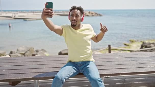 African American Man Recording Video Smartphone Dancing Seaside — Stock Video