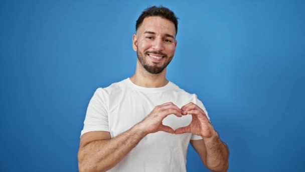 Young Arab Man Smiling Confident Doing Heart Gesture Hands Isolated — Stock Video