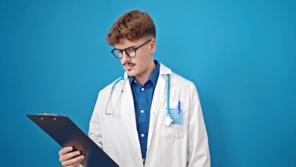 Young Hispanic Man Doctor Reading Document Clipboard Saying Head Isolated — Stock Video