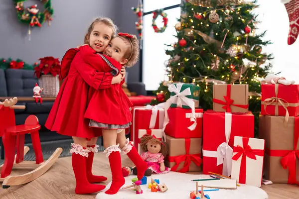 Adorable Girls Hugging Each Other Celebrating Christmas Home — Stock Photo, Image
