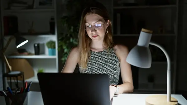 Young blonde woman business worker using laptop working at the office