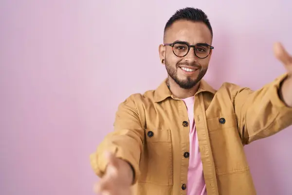 Young Hispanic Man Standing Pink Background Looking Camera Smiling Open — Zdjęcie stockowe