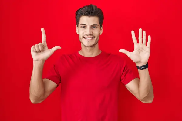 Young Hispanic Man Standing Red Background Showing Pointing Fingers Number — Stock Photo, Image