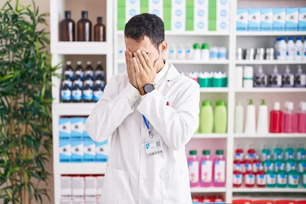 Handsome Hispanic Man Working Pharmacy Drugstore Sad Expression Covering Face — Stock Photo, Image