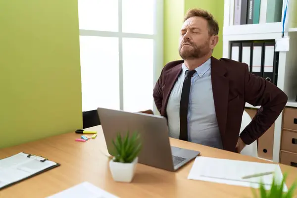 Middle age man business worker stressed working at office