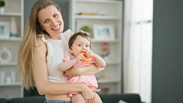 Mother Daughter Hugging Each Other Sucking Toy Home — Stock Photo, Image