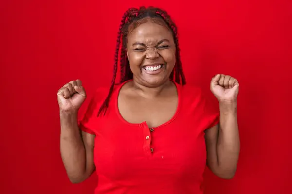 African American Woman Braided Hair Standing Red Background Excited Success — Stock Photo, Image