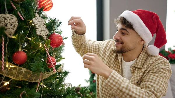 Young Arab Man Decorating Christmas Tree Home Stock Photo