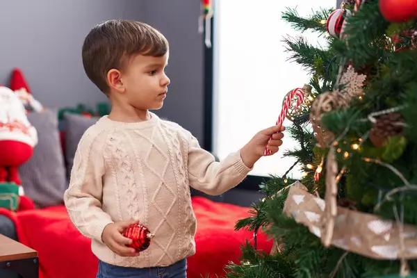 Adorable Hispanic Boy Decorating Christmas Tree Home — Stock Photo, Image
