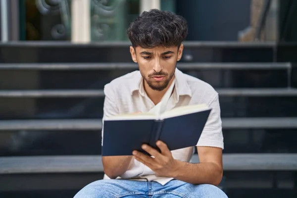 Young Arab Man Reading Book Sitting Stairs Street — Stockfoto