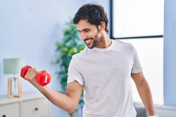 Young Hispanic Man Smiling Confident Using Dumbbell Training Home — Foto Stock