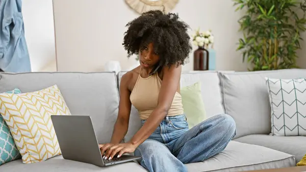 African American Woman Talking Smartphone Using Laptop Home — Stock Photo, Image