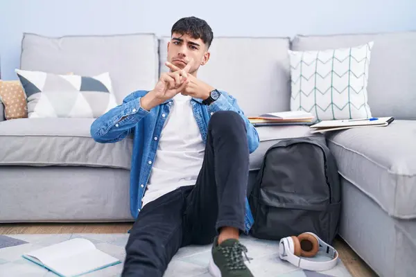 Young Hispanic Man Sitting Floor Studying University Rejection Expression Crossing — Stock Photo, Image